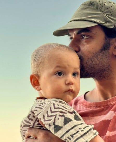 Hans holding baby Akhoda