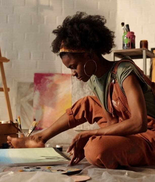Artist in a sun-drenched workshop
