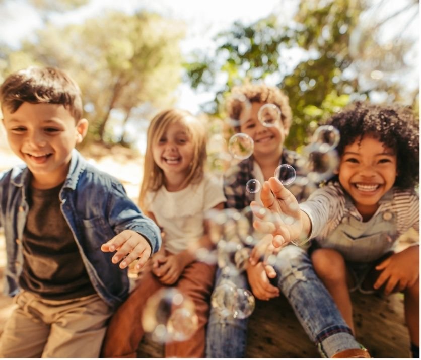 Happy children playing together outdoors